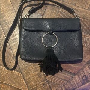 Anthropologie Street Level  Black Faux Leather Crossbody Bag with Tassel Detail.